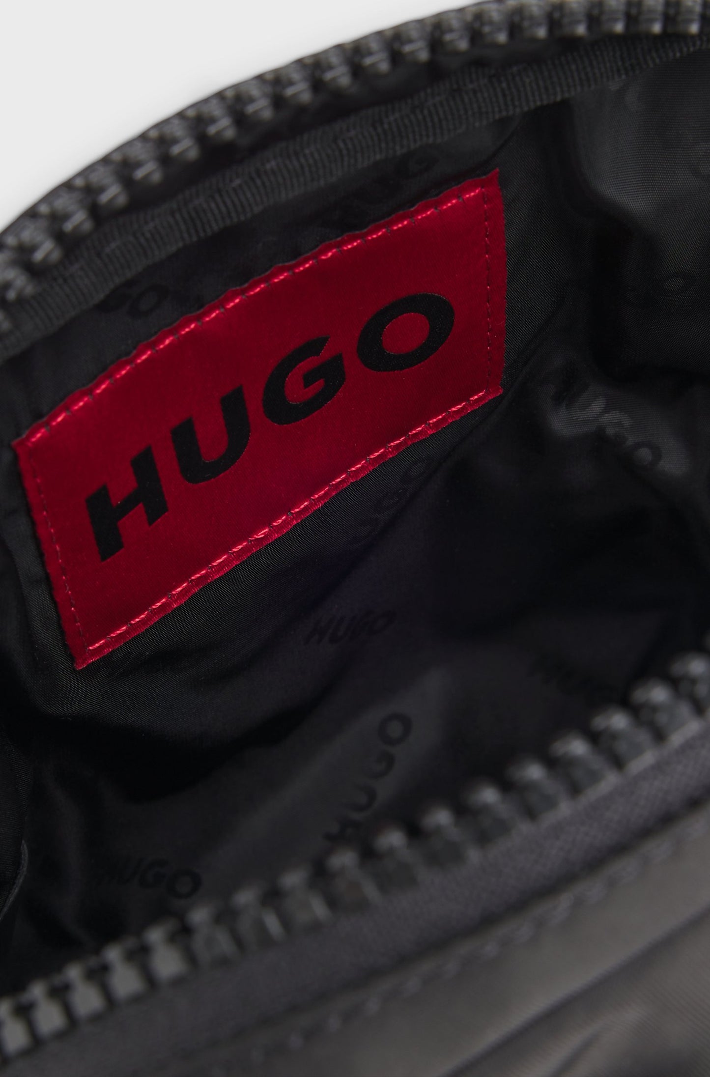 Sac reporter avec étiquette logo caoutchoutée